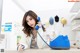 A woman sitting at a desk talking on a phone.